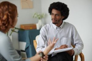 a therapist listens to a patient during motivational interviewing 