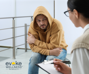 male patient with substance use disorder discusses managing drug comedowns with his behavioral health specialist